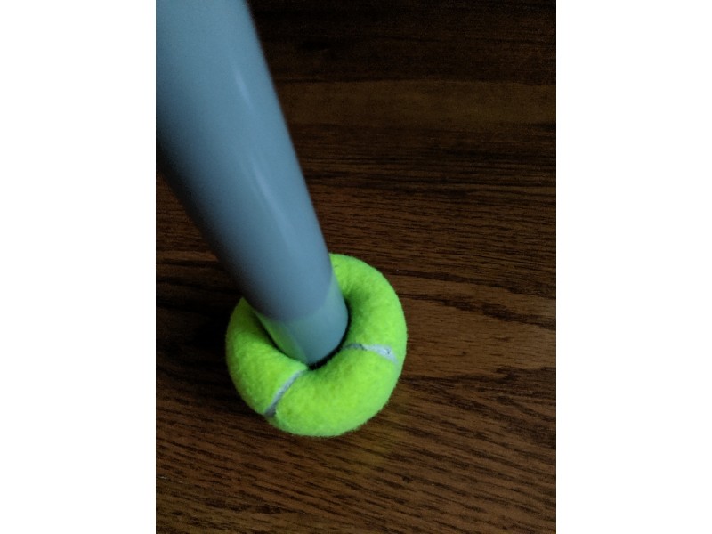 Tennis ball on walker leg